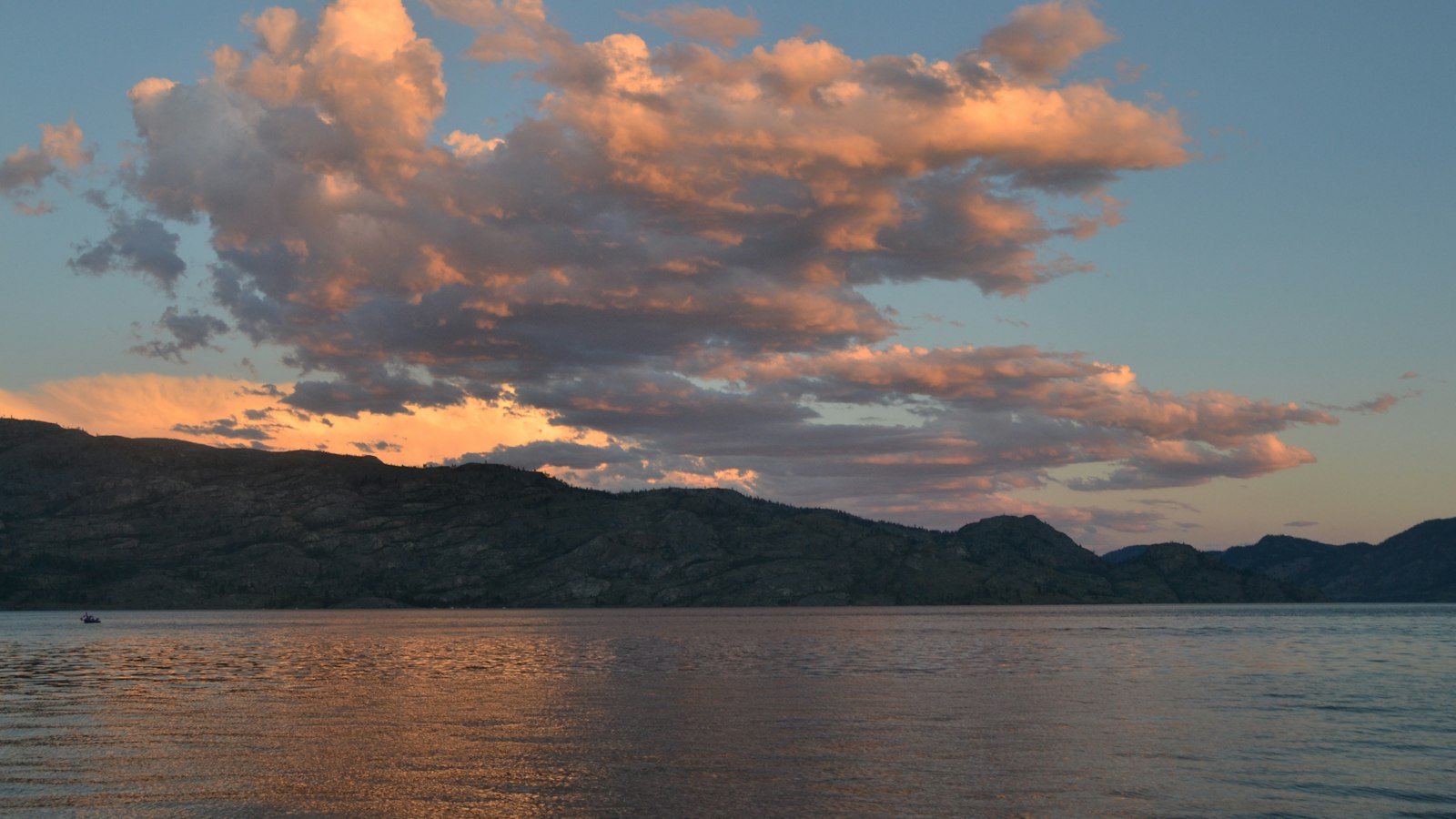 Aerial view of Okanagan Lake and the surrounding hills and neighbourhoods