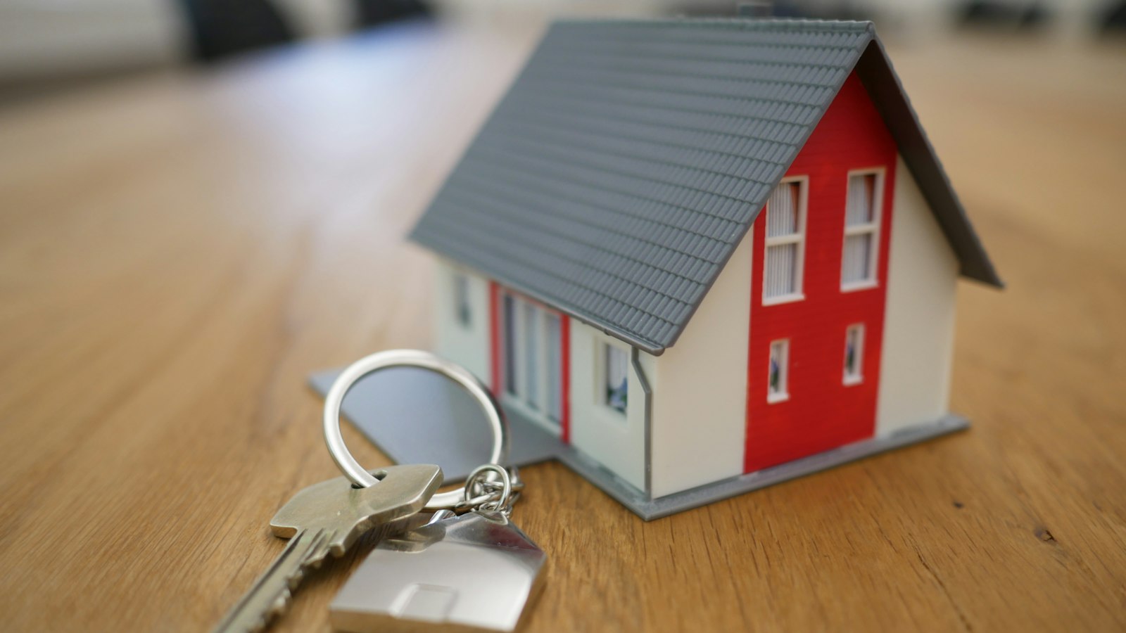 A buyer holding the keys to a new home in Vernon, BC after completing the purchase