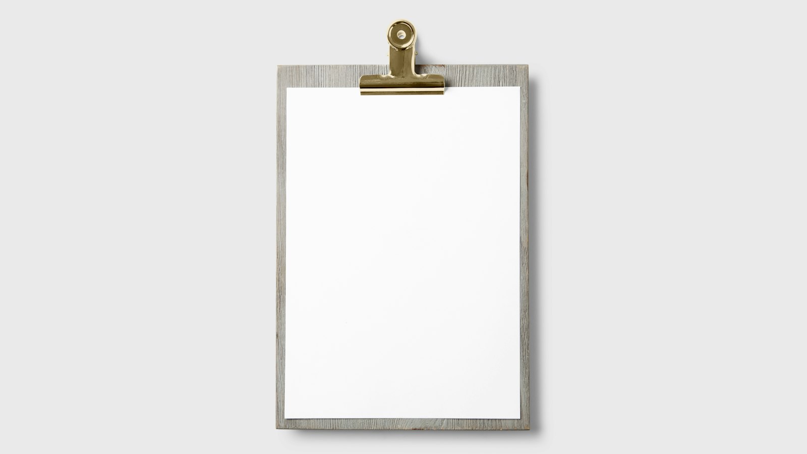A clipboard with a checklist on a kitchen counter, representing a Vernon seller's home marketing plan